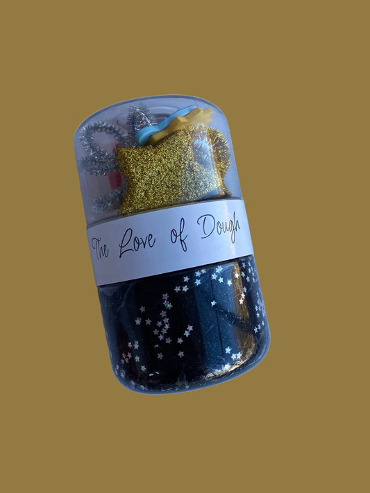 play dough jar with small trinkets.