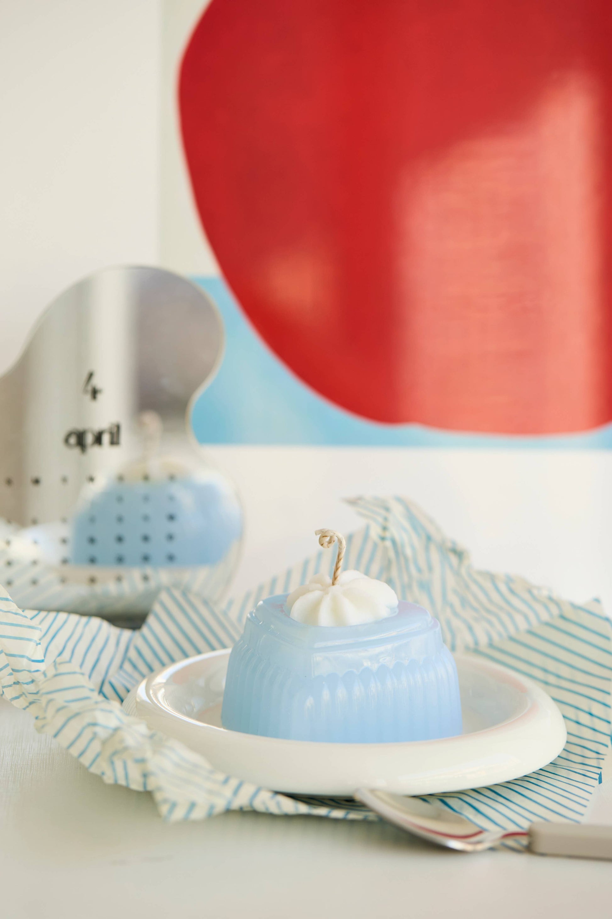 The Adoration candle, a clear blue heart of glossy jelly wax.