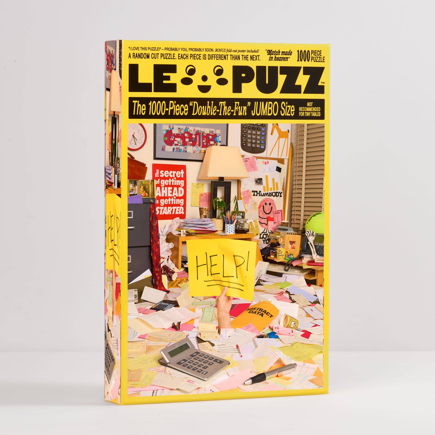 Le Puzz puzzle box with a colorful interior scene and 'HELP!' sign on a white background