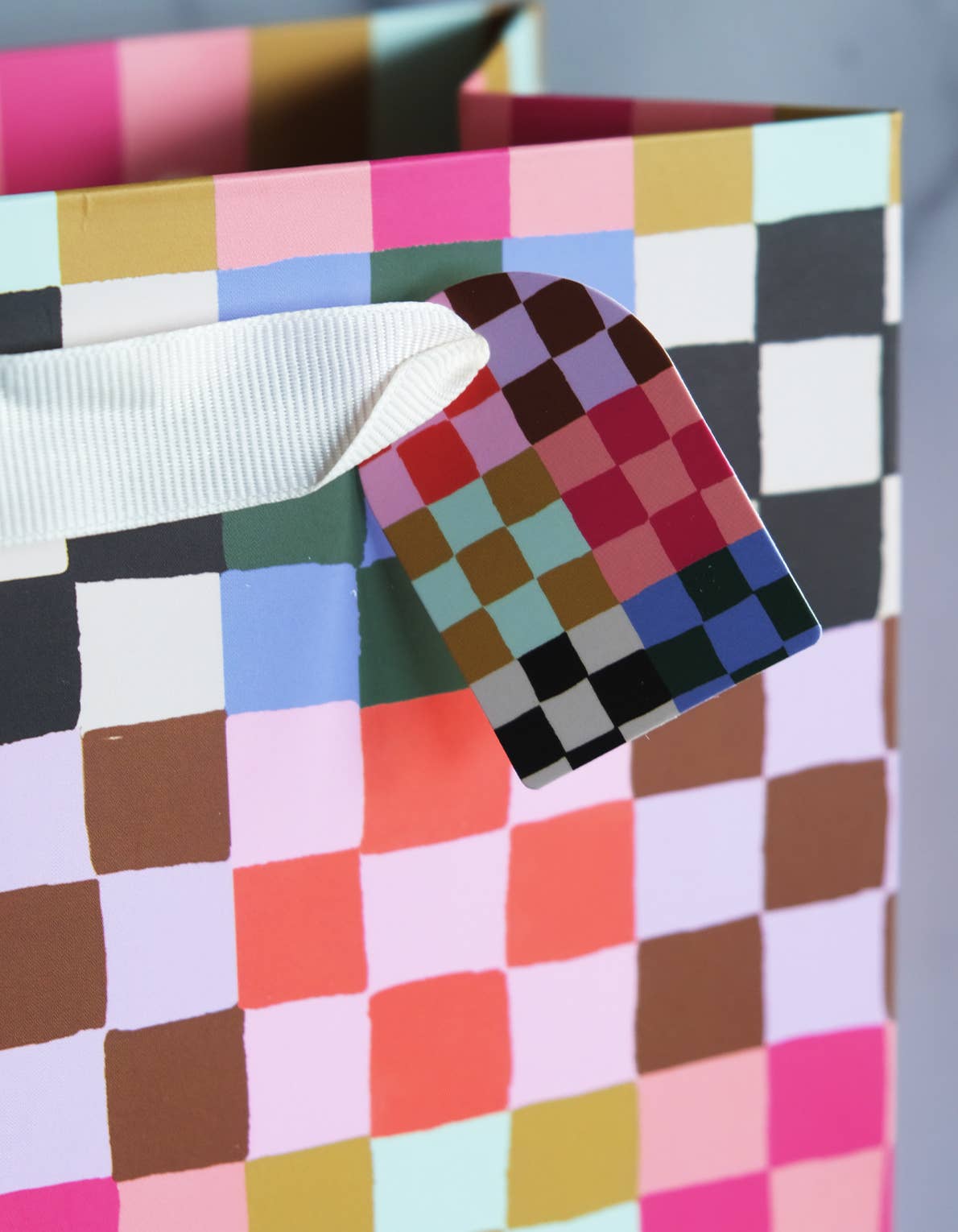 Close-up of the tag, a checkered background