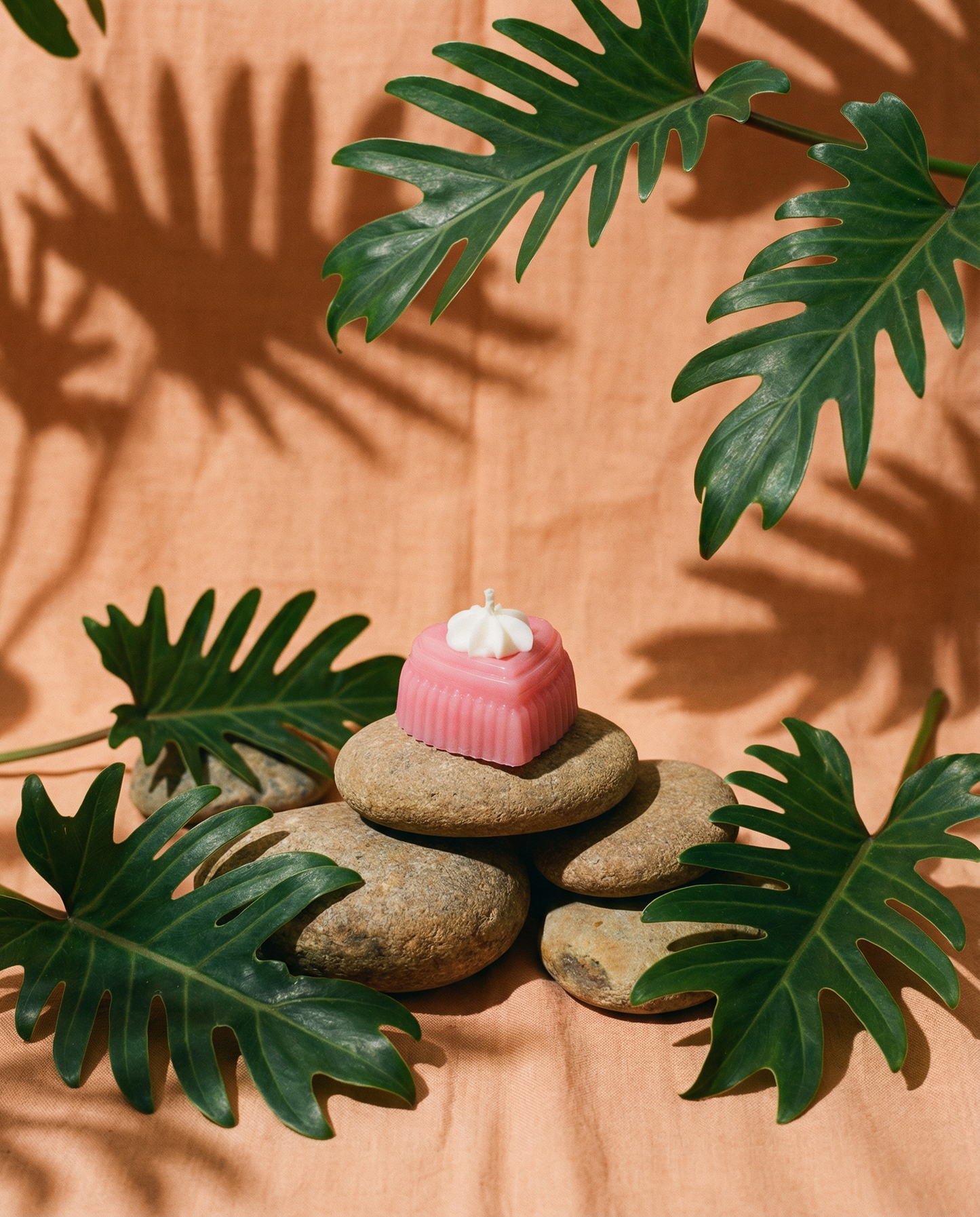The Courtship candle, a clear pink heart of glossy jelly wax.