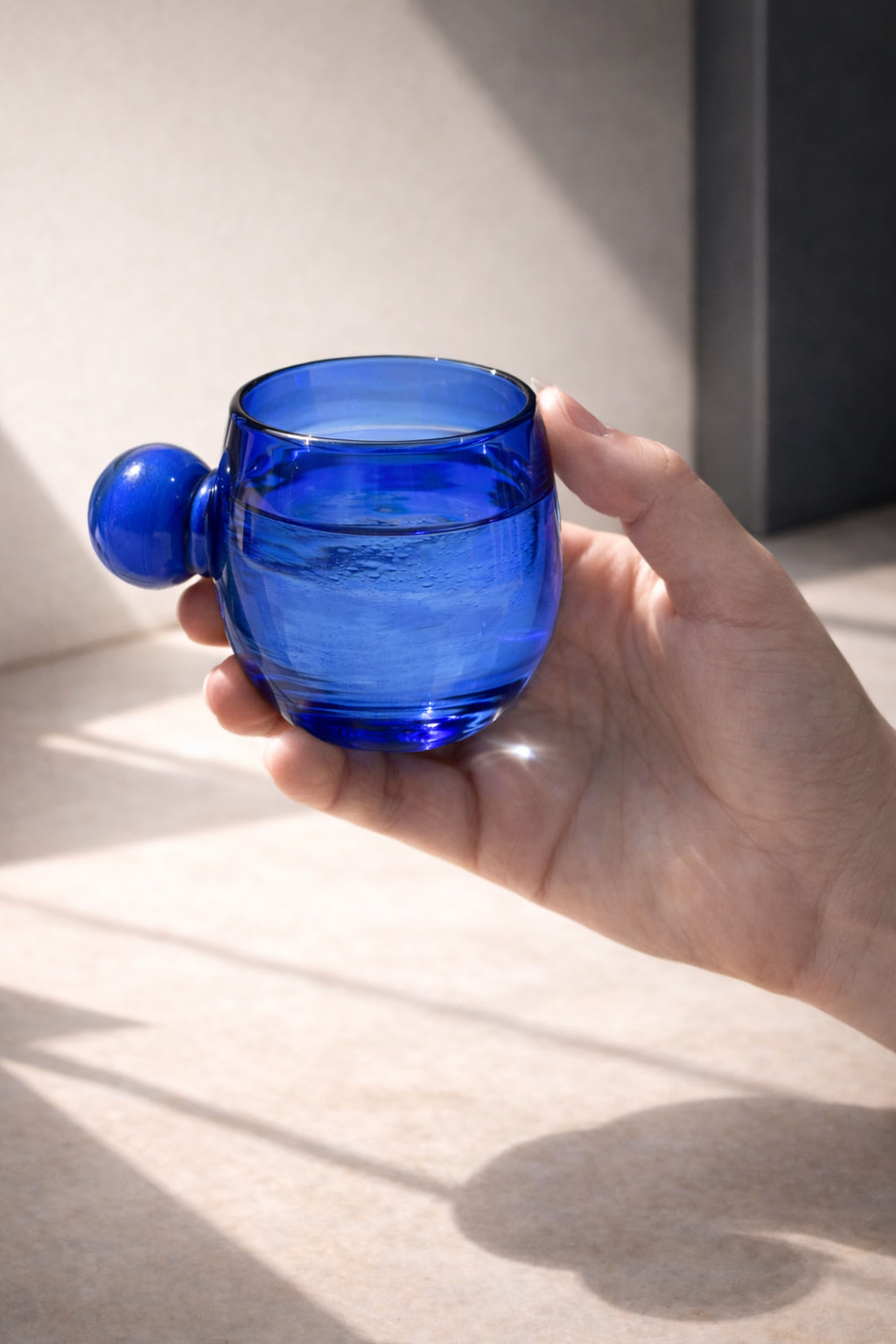 A single Salinas short glass in recycled blue glass.