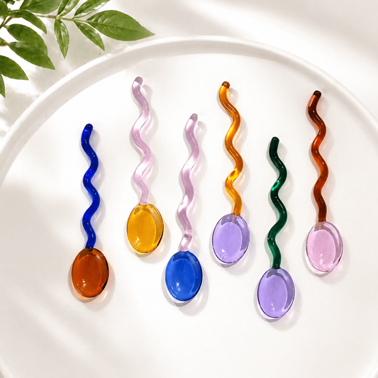 Colored glass stirring spoon with a slender twisted handle