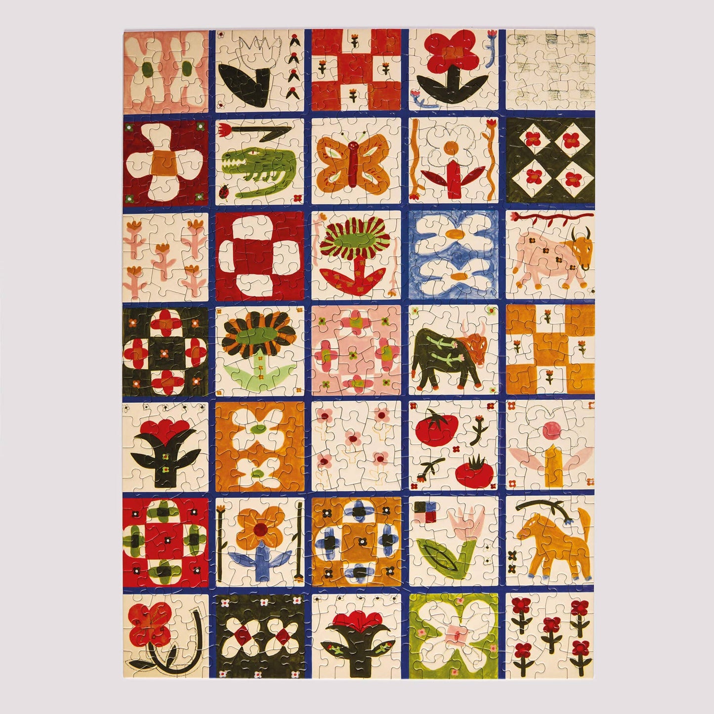 Colorful quilt/tile design with various patterns and shapes on a white background