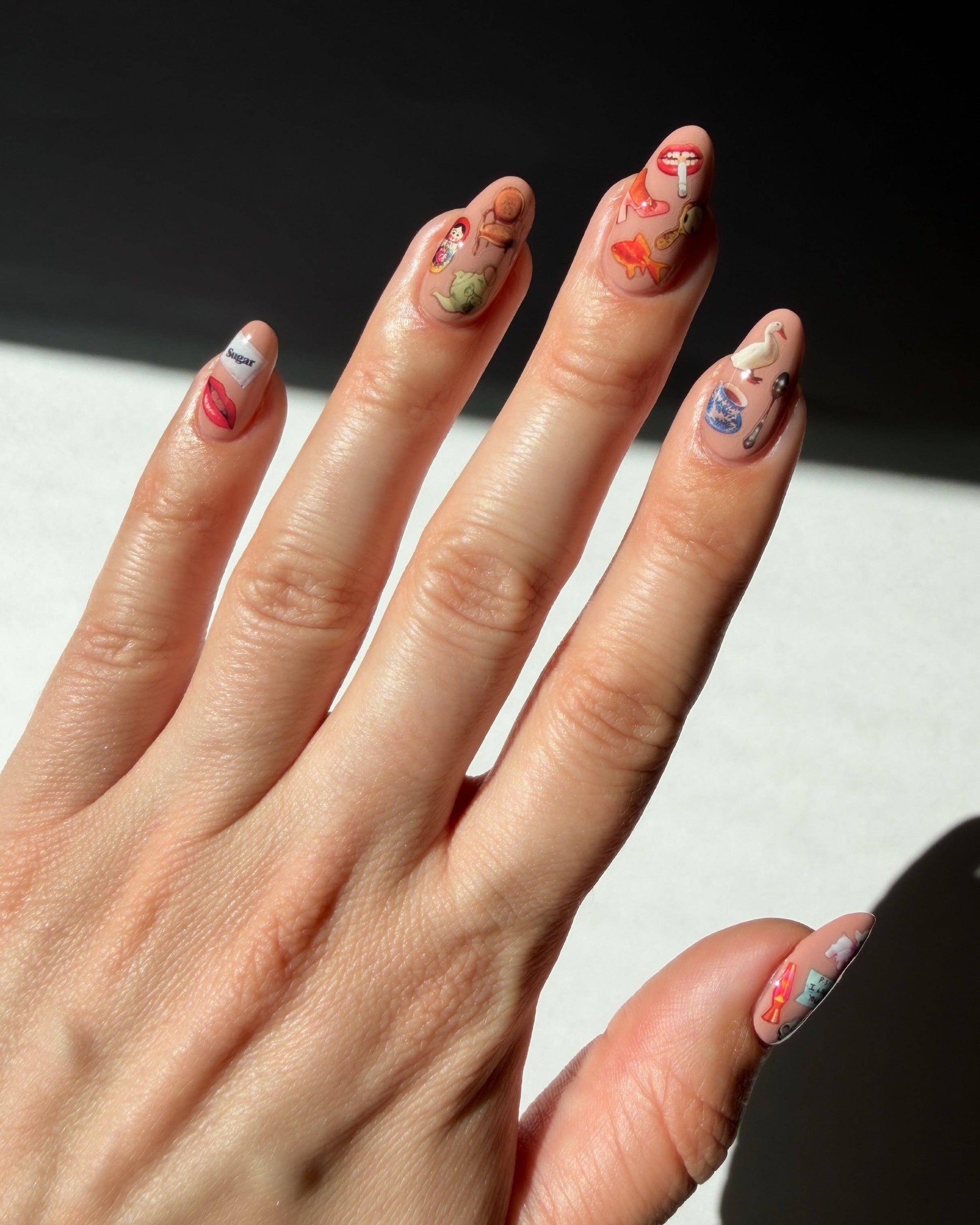 Deco Beauty x Haricot Vert nail stickers featuring teacup, key, and teddy bear designs