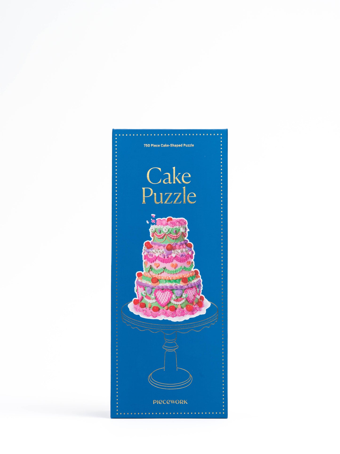 Completed cake-shaped puzzle resembling an over-the-top tiered celebration cake.