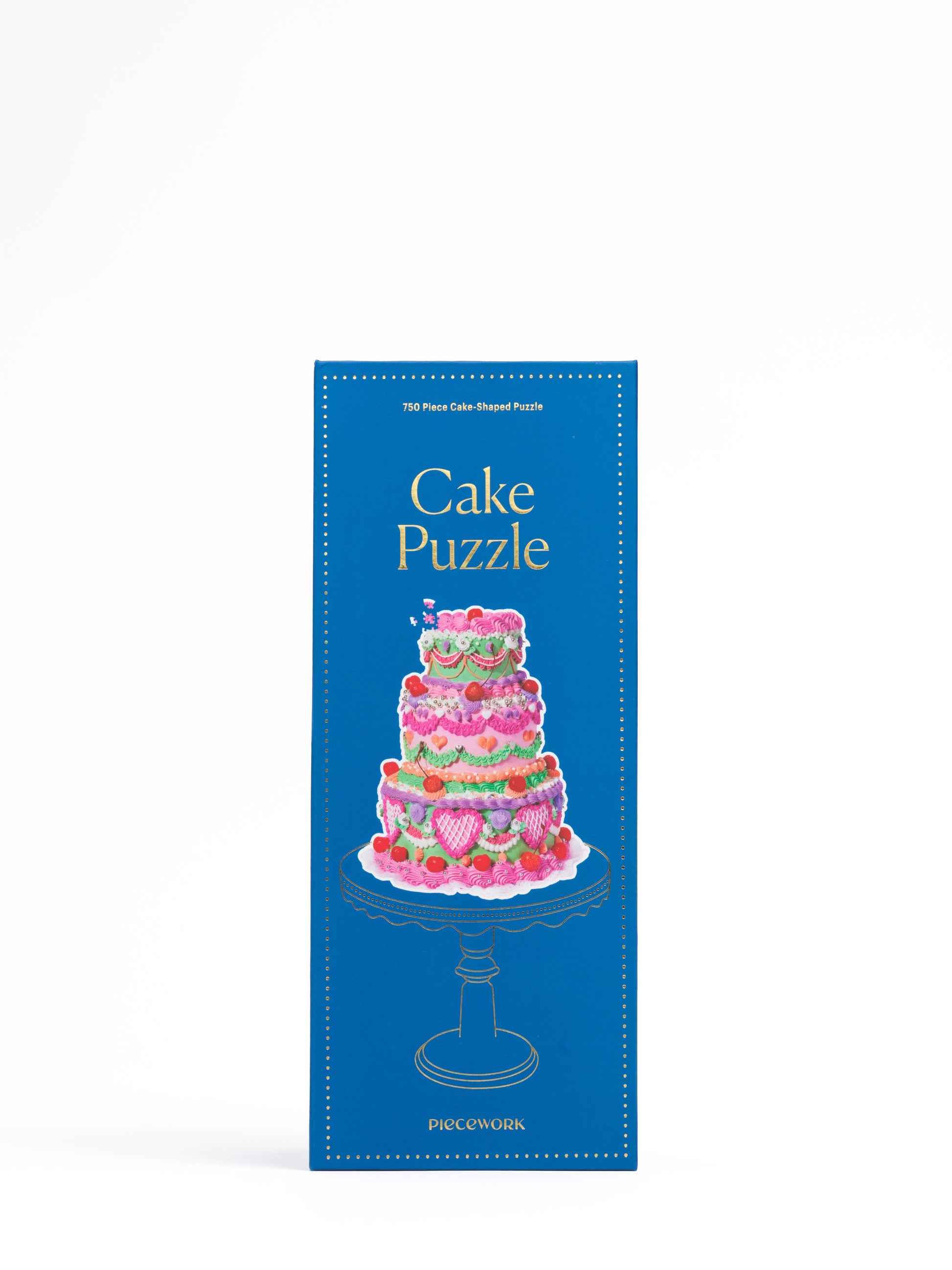 Completed cake-shaped puzzle resembling an over-the-top tiered celebration cake.