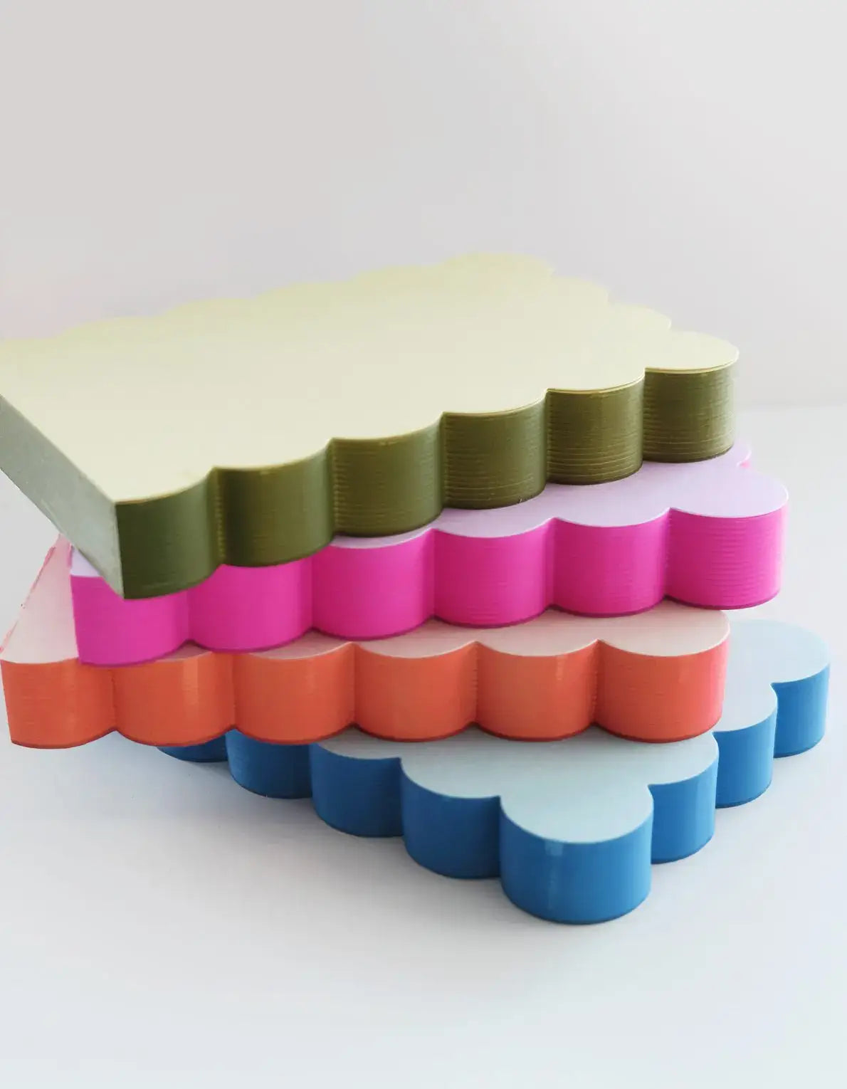 Stack of colorful layered blocks on a white background