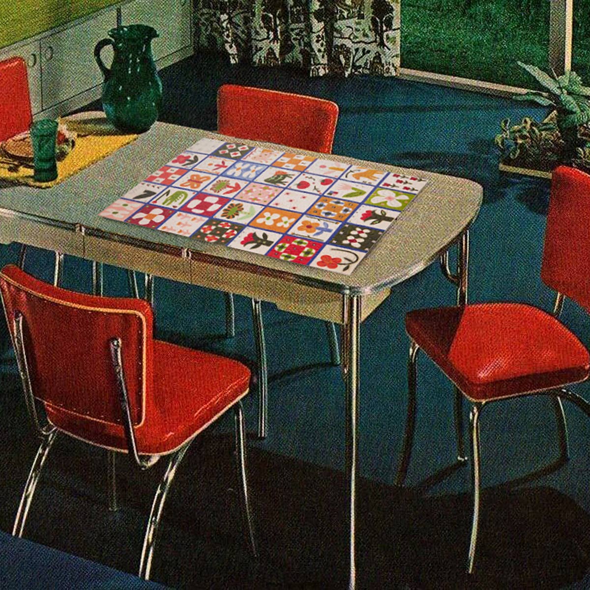 Vintage-style kitchen table with red chairs and the pattern of the puzzle.