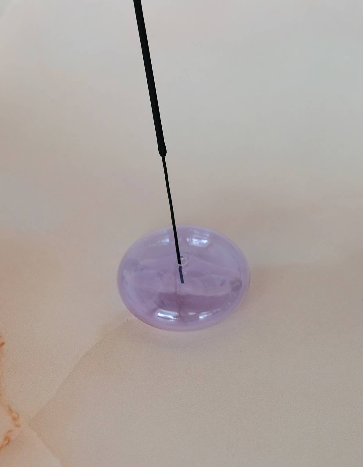 Bubble glass incense holders in an assortment of translucent colors