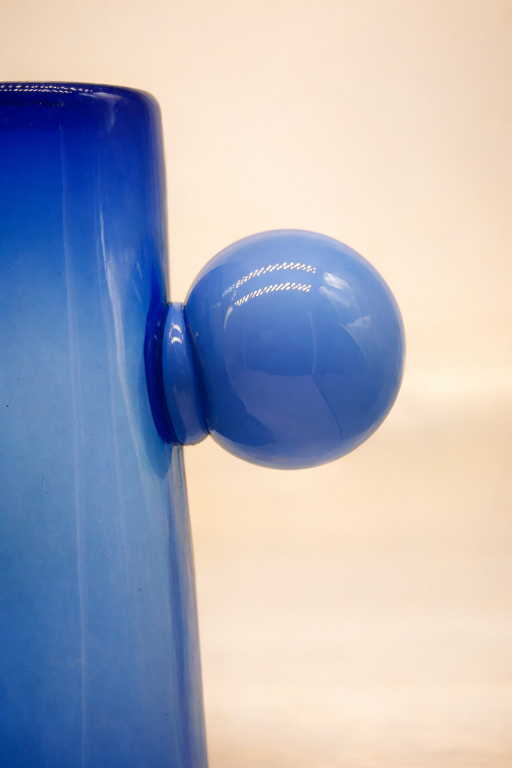 Close view of the Tepezala pitcher's mouth-blown recycled glass.