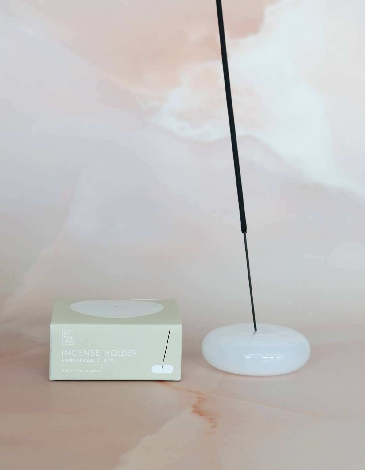 Bubble glass incense holders in an assortment of translucent colors