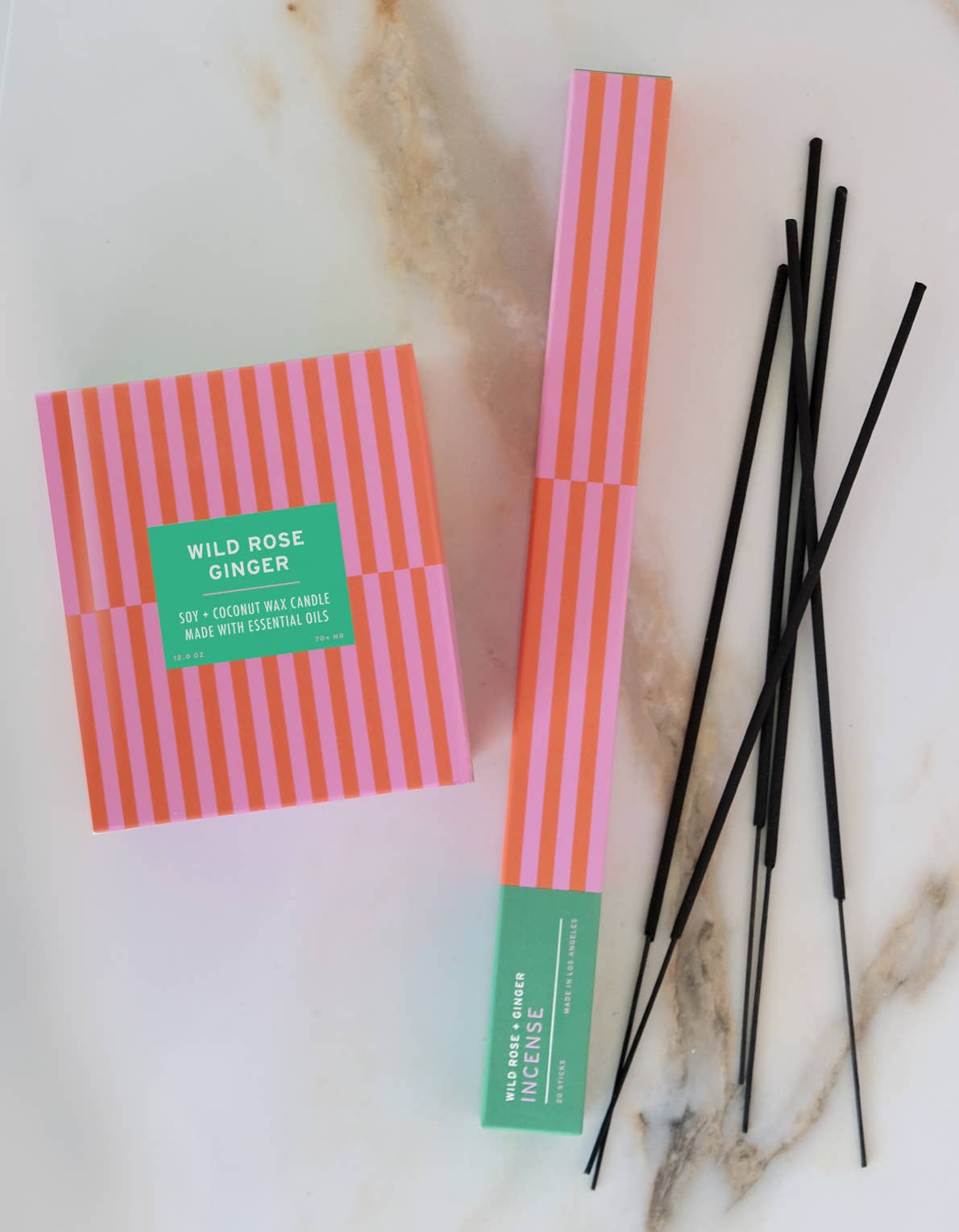 Wild Rose + Ginger incense sticks styled on a surface
