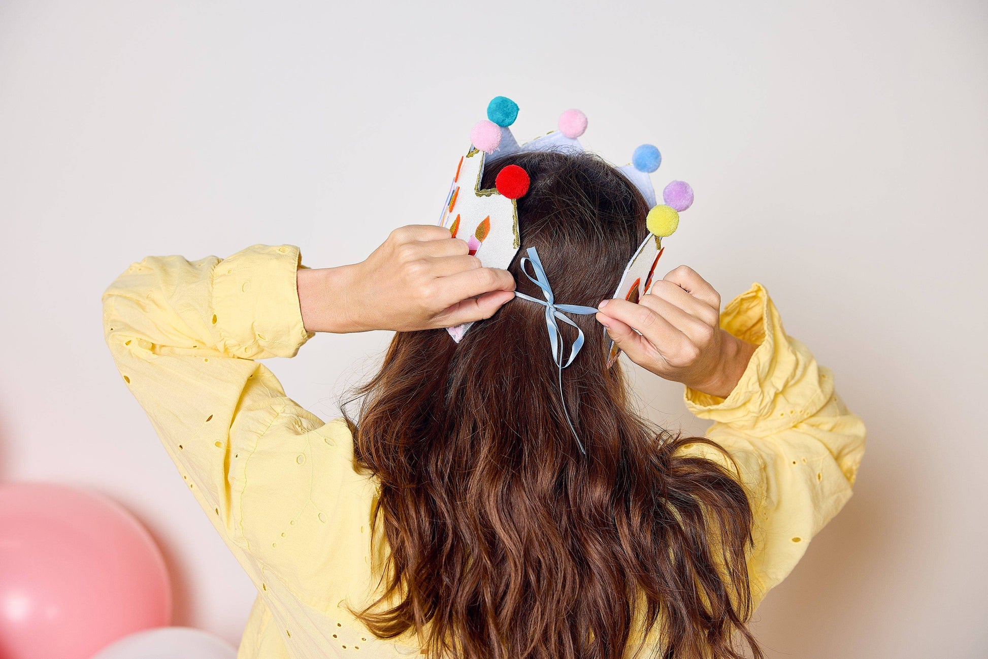 Birthday crown trimmed with a row of colorful felt candles.
