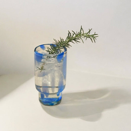 The Frida tall glasses in blue and clear, shown from another angle.