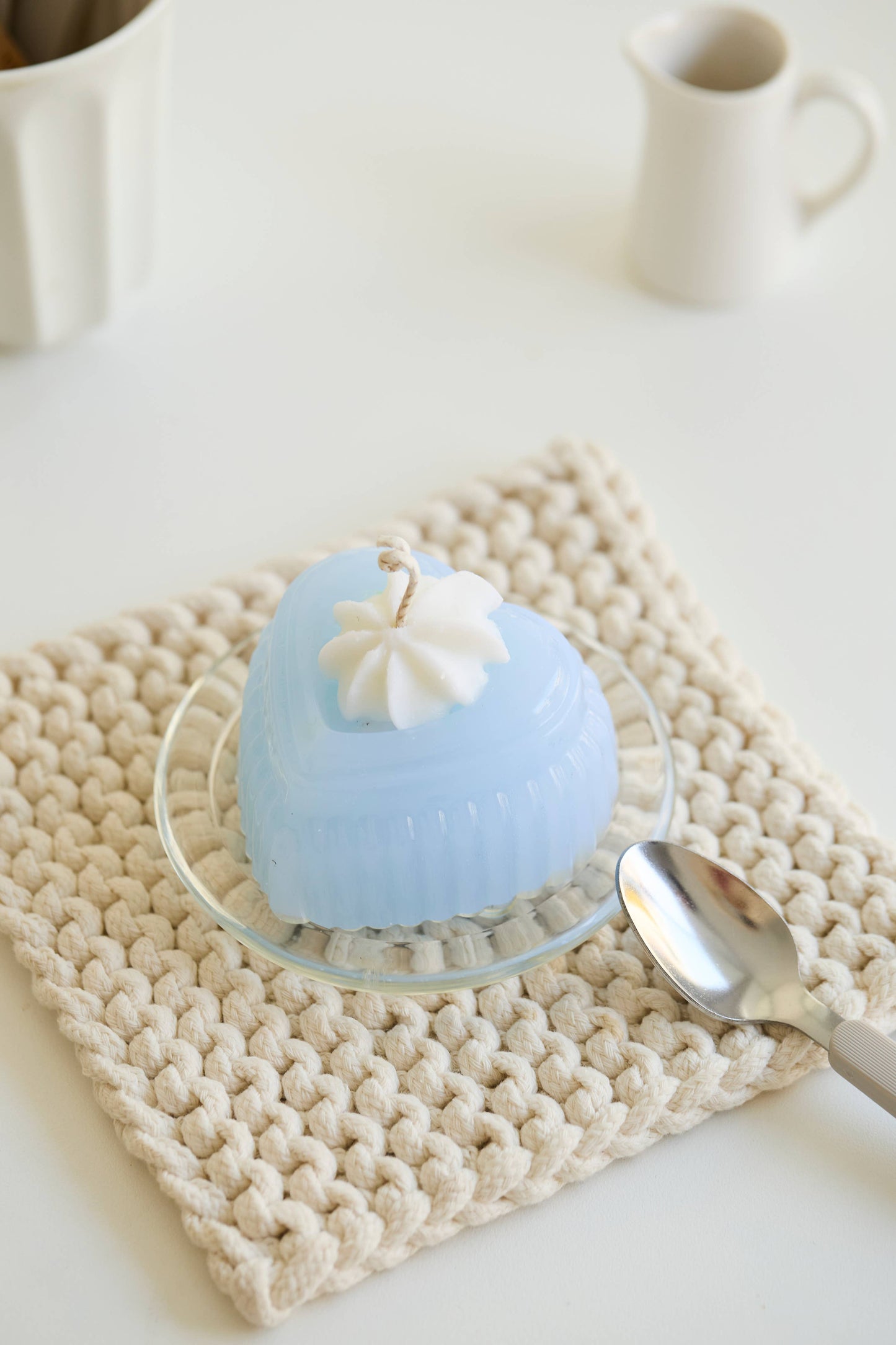 Adoration jelly candle showing its smooth, translucent blue body.