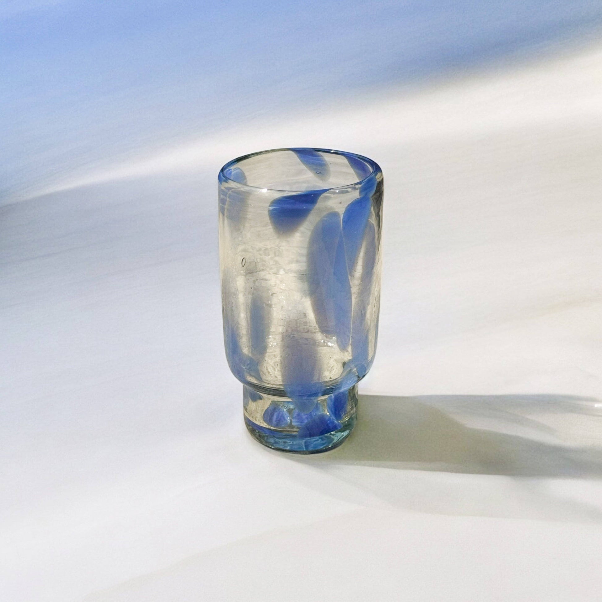 Close view of the blue and clear Frida tall glasses.