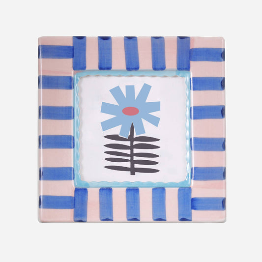 Square hand-painted ceramic photo frame with a blue-and-white striped border and a small painted blue flower.