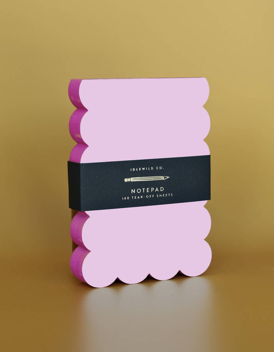 Scalloped die-cut notepad with lilac and hot pink painted edges