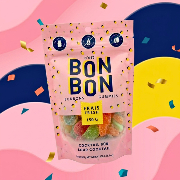 Pink package of Bon Bon gummies on a colorful abstract background