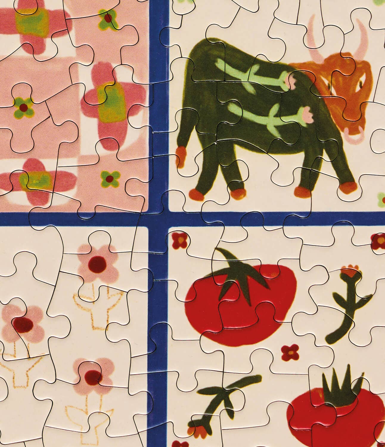 Partial puzzle with a bull and tomato design on a beige background
