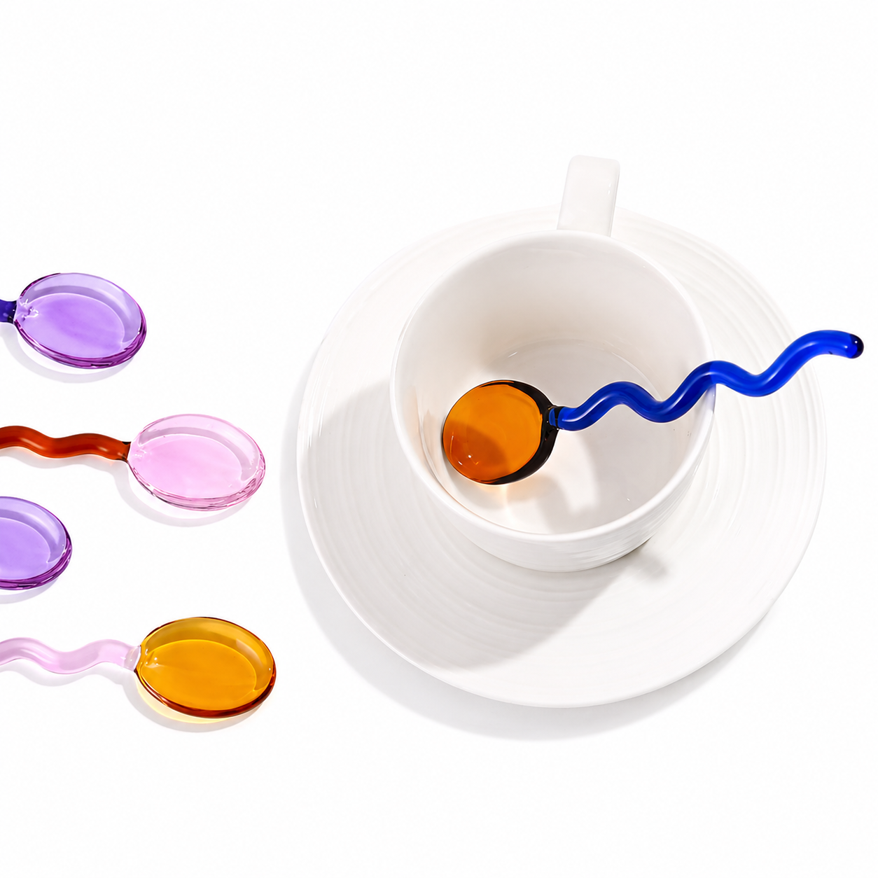 Colored glass drink stirring spoon with a tapered end