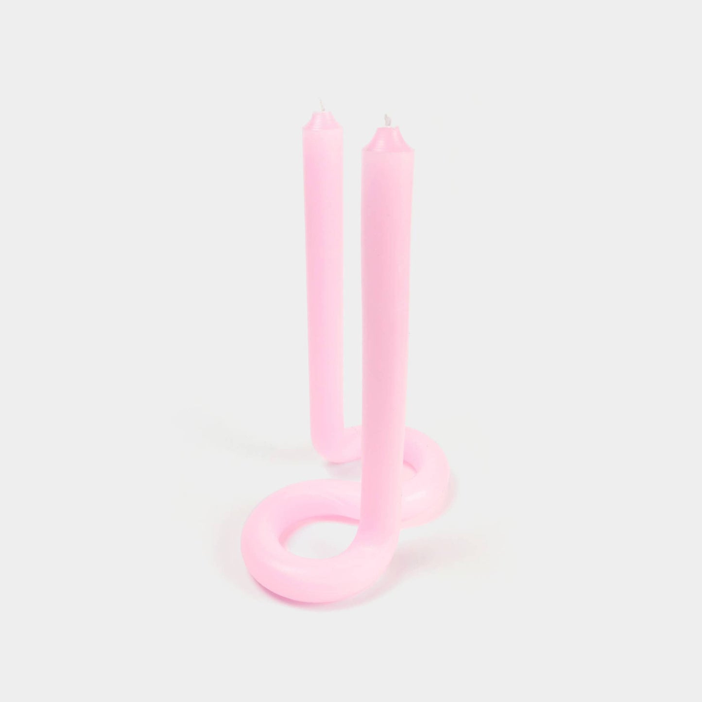Light pink Twist candle stick by 54 Celsius, a double-ended twisted candle that stands on its own