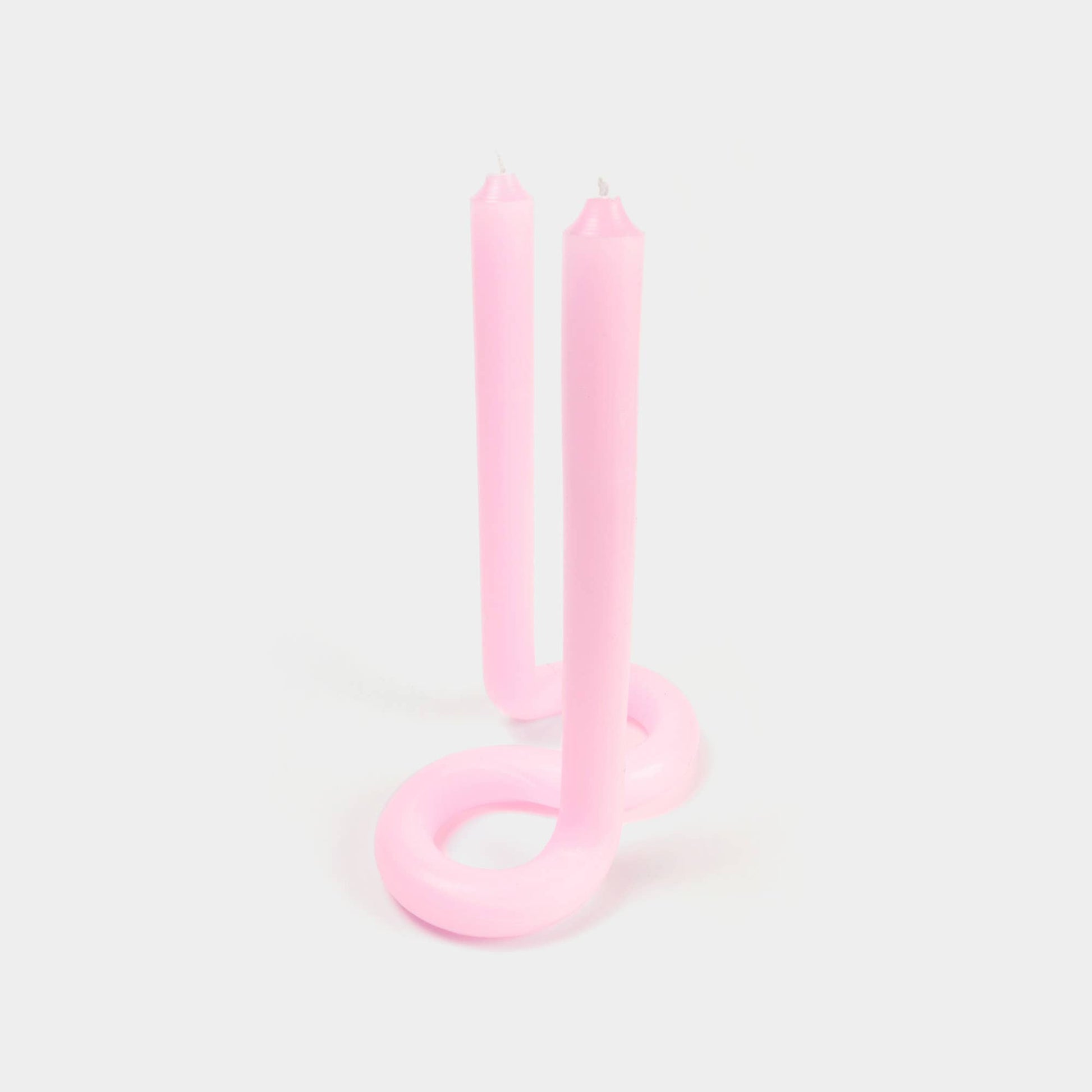 Light pink Twist candle stick by 54 Celsius, a double-ended twisted candle that stands on its own