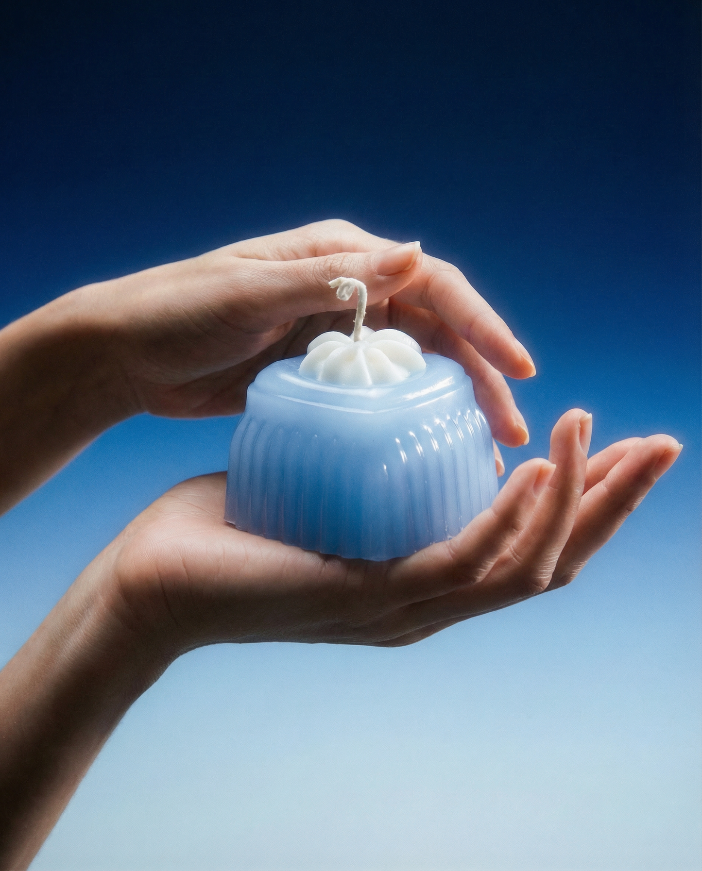 Adoration blue heart-shaped jelly wax candle, front product view.
