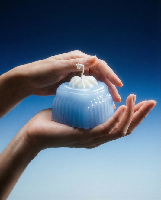 Adoration blue heart-shaped jelly wax candle, front product view.
