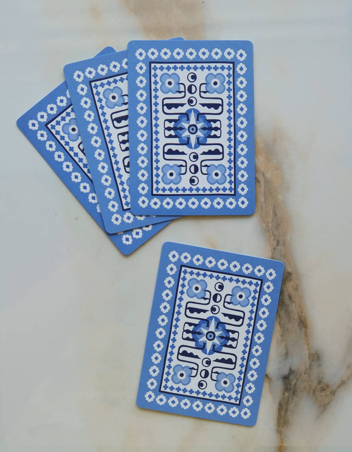 Blue background of the playing cards with intricate designs