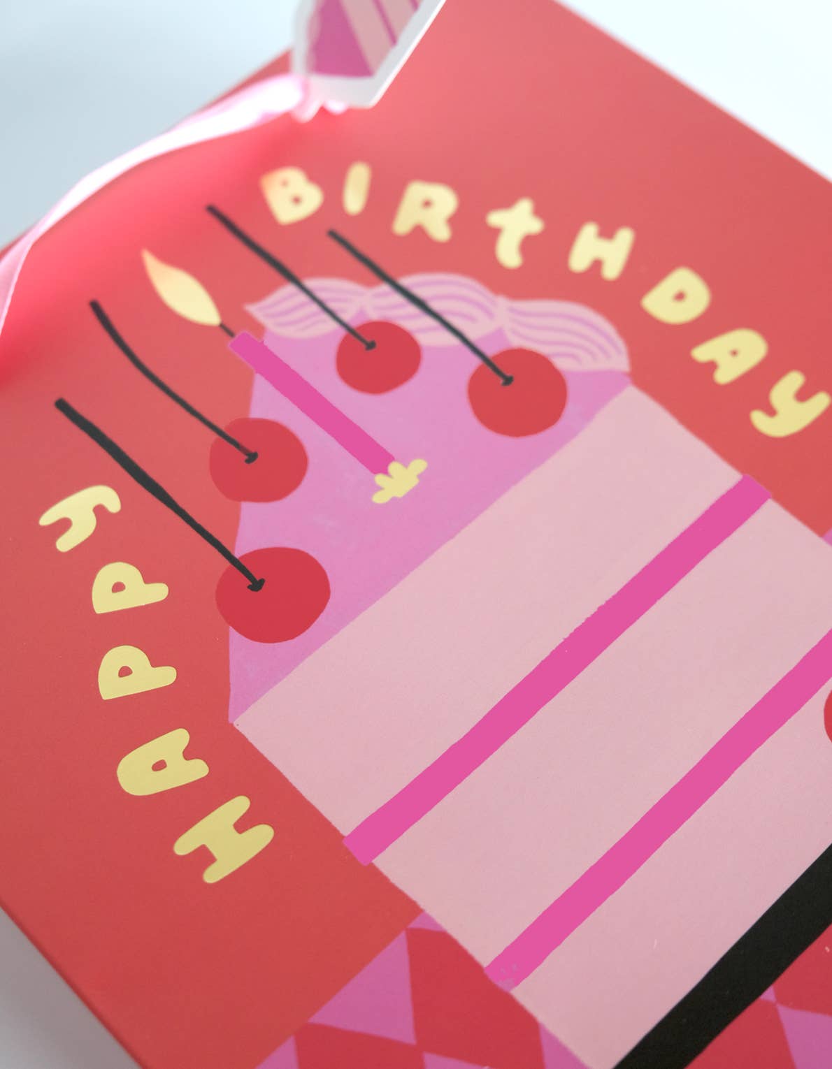 Happy Birthday card with cake illustration on a red background