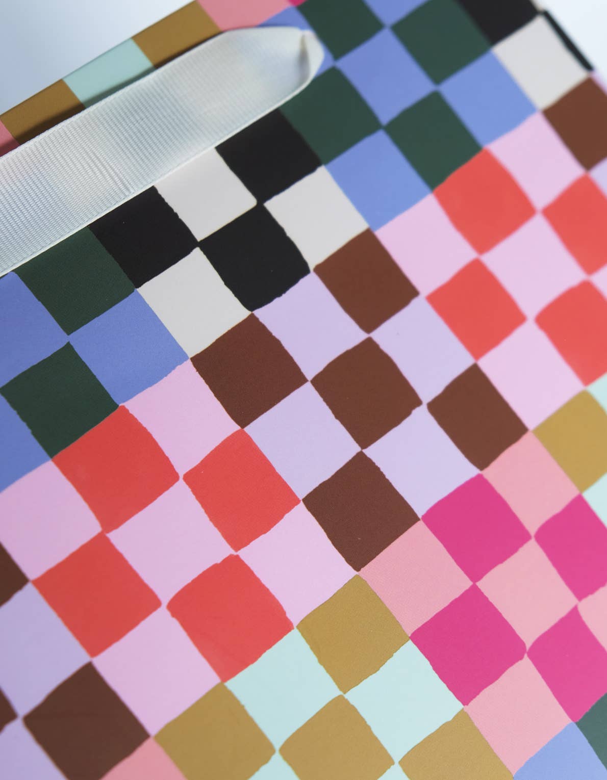 Close detail of a checkered pattern in various colors
