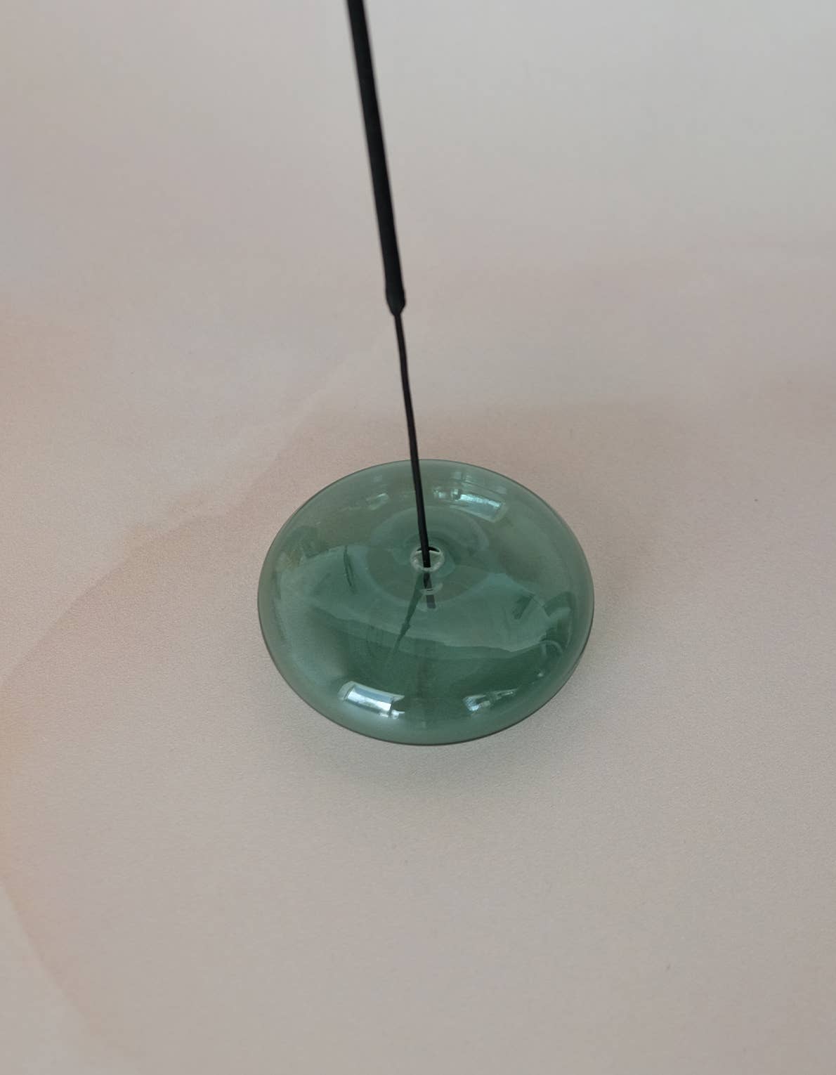 Handblown bubble glass incense holder beside its gift box