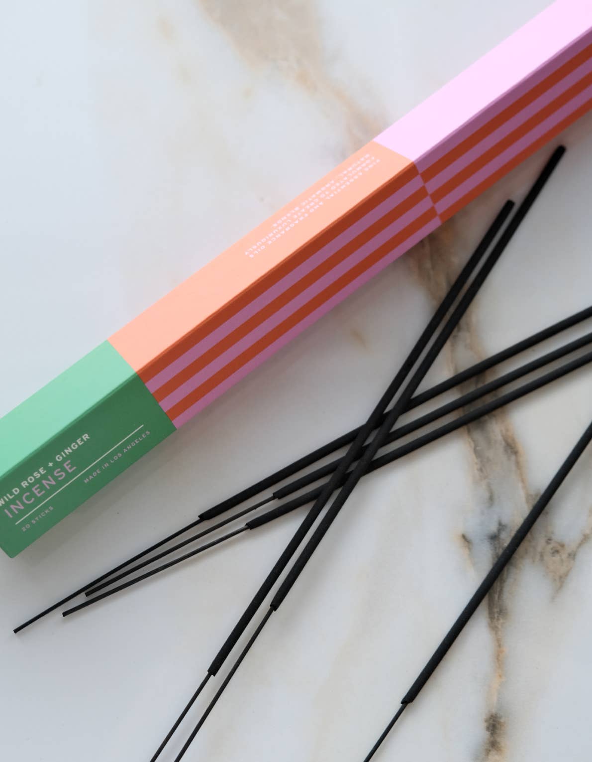 Botanica Wild Rose + Ginger incense sticks beside their box
