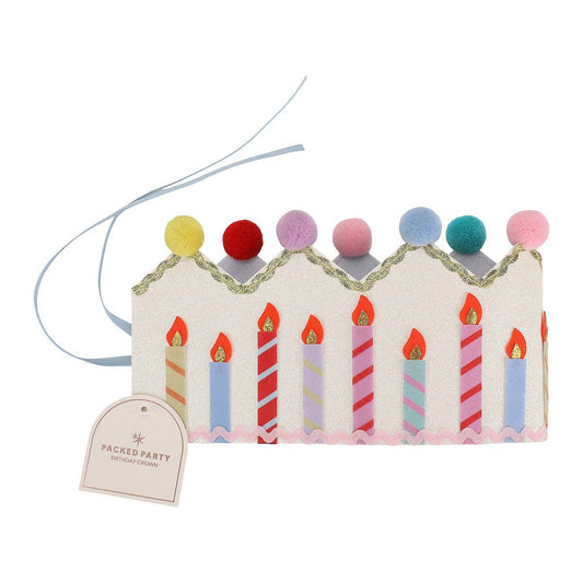 Glitter-felt birthday crown topped with multicolor pom poms and felt candle shapes.