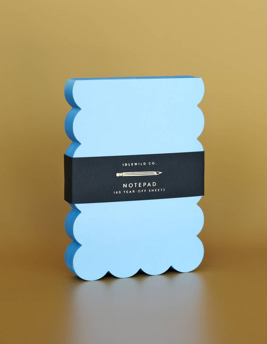 Scalloped die-cut notepad with aqua and blue painted edges