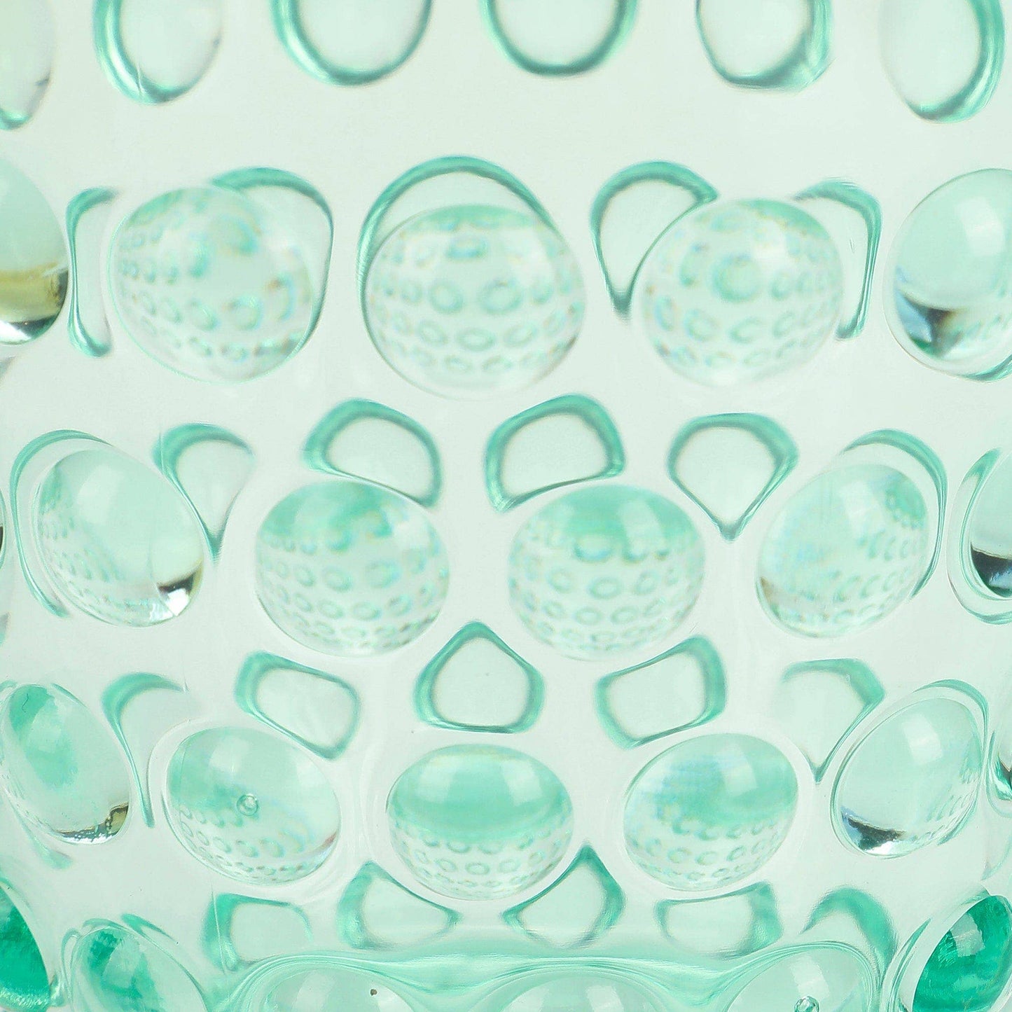 Close-up of a single textured pastel cup.