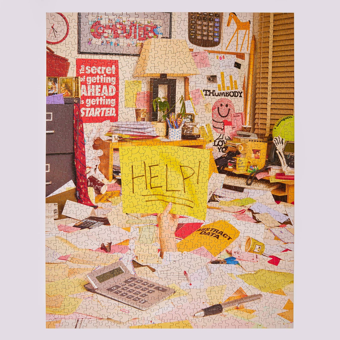 Jumbled puzzle with a chaotic office scene, including a desk, lamp, and 'HELP!' sign.