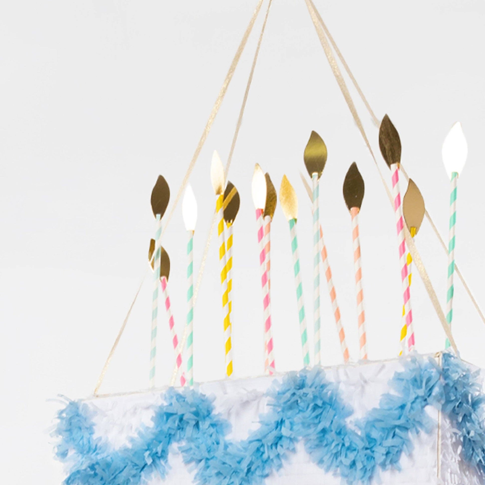Tiered tissue-paper birthday cake piñata