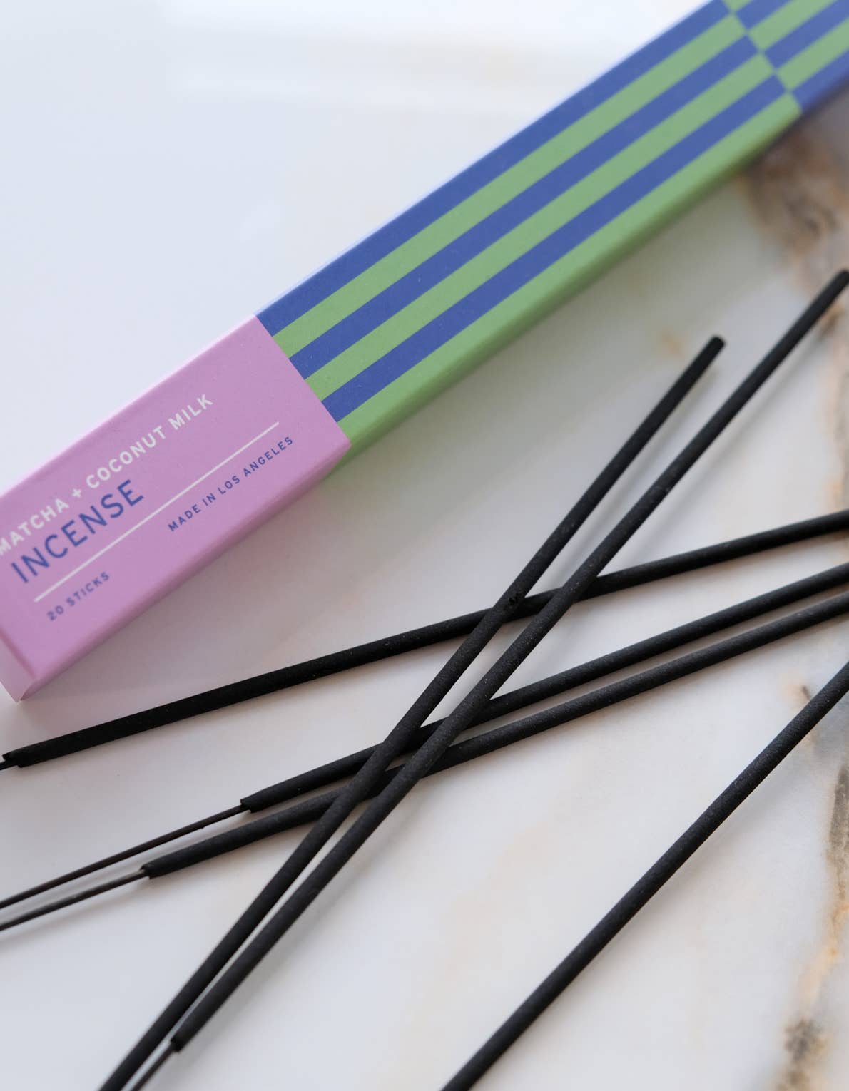 Botanica Matcha + Coconut Milk incense sticks beside their box